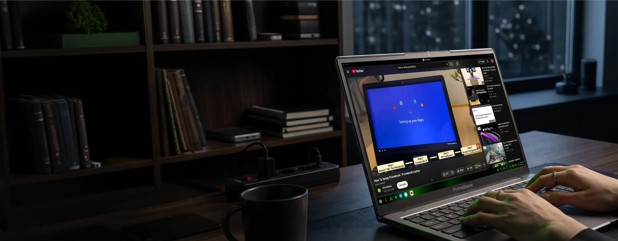 Primebook laptop on a desk playing a step-by-step video on setting up a Primebook
