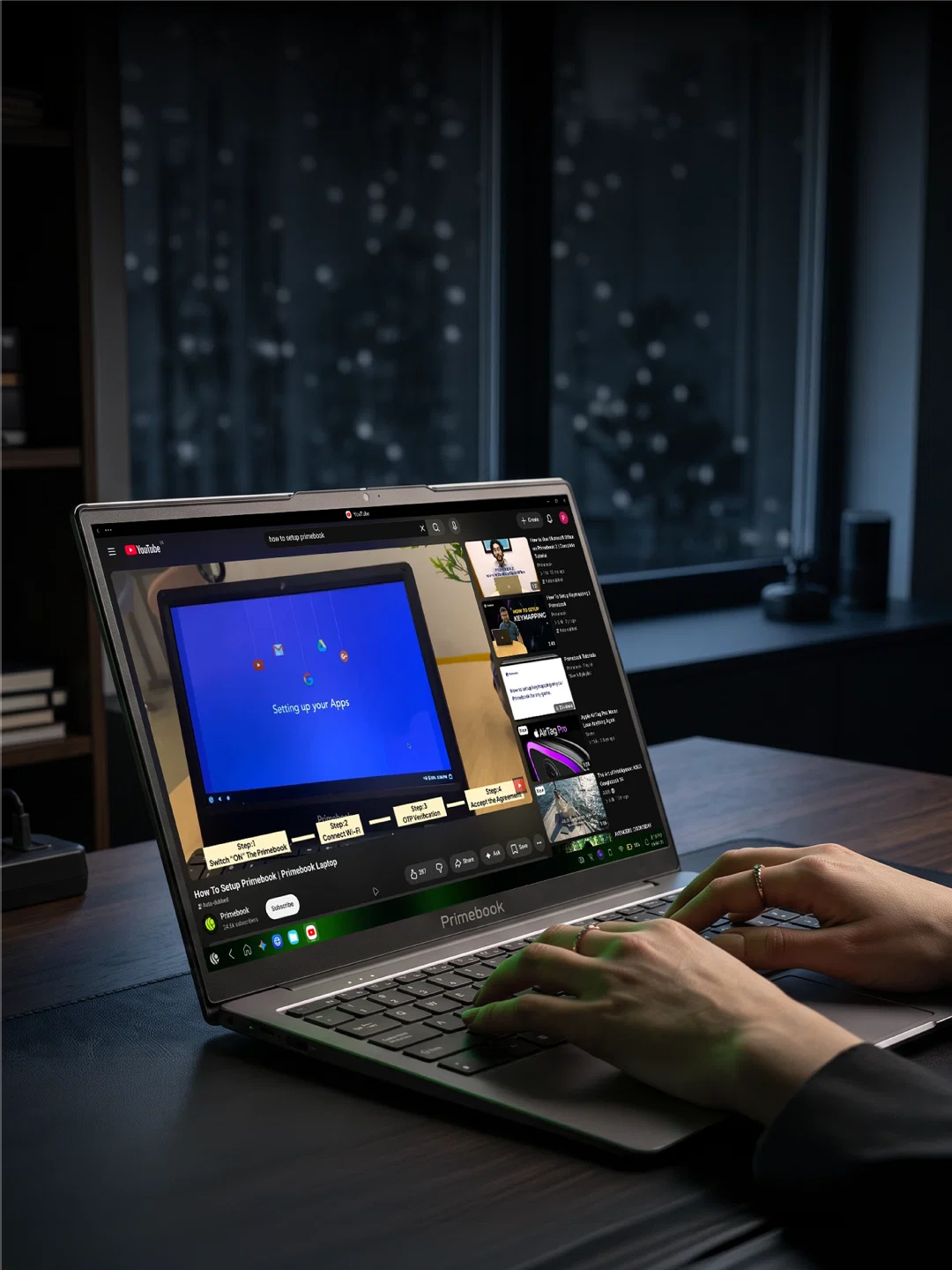Primebook laptop on a desk playing a step-by-step video on setting up a Primebook